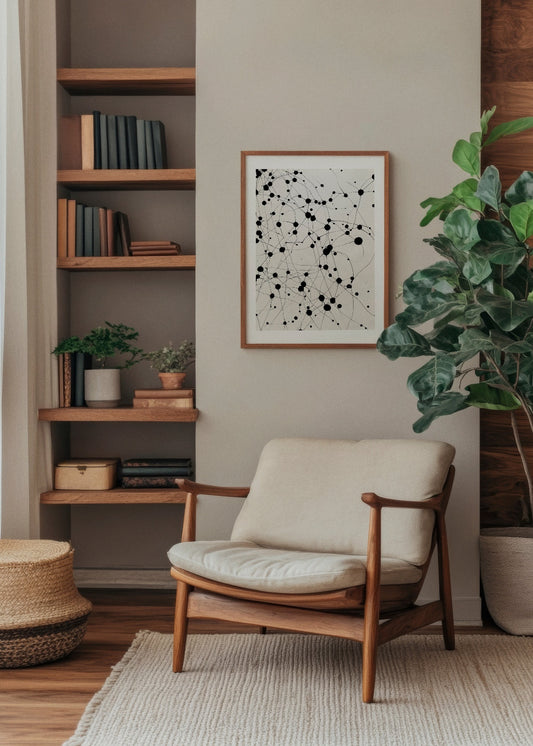 Abstract 'Dots' poster with black dots and connecting lines, framed in a cozy, Scandinavian-inspired reading nook. The minimalist design adds a modern and artistic flair, perfectly complementing natural wood tones and greenery. Ideal for creating a calm yet dynamic atmosphere in Nordic interiors.