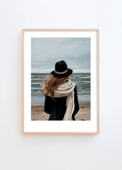 A Walk By The Sea poster in a minimalist Scandinavian interior with light grey wall and natural wood frame, featuring calm blue, beige and soft neutral coastal tones.