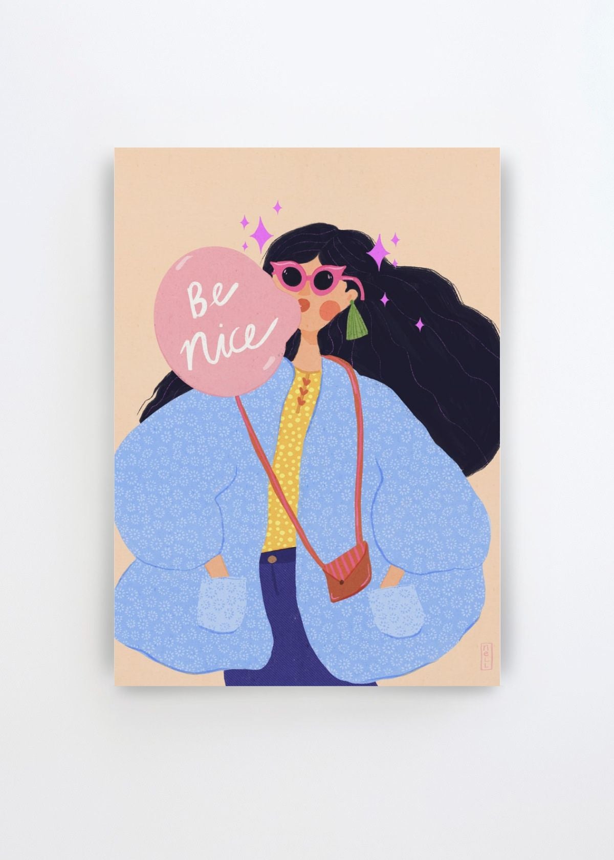 Be Nice Bubblegum Girl by Dirkie Nell art print featuring a stylish woman with long dark hair, oversized pink sunglasses and a powder blue jacket holding a large pink bubblegum-style sign reading “Be Nice”.