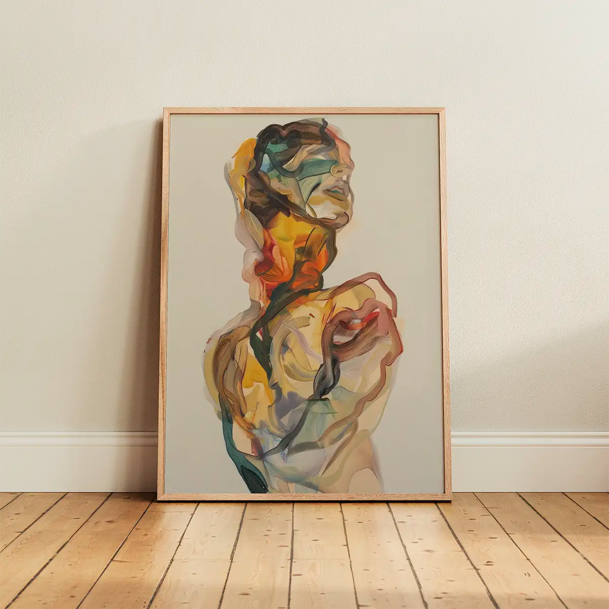 Colourful abstract portrait poster in warm earthy tones, framed in oak and leaning against a white wall on natural wooden flooring, soft daylight enhancing the artwork’s texture.