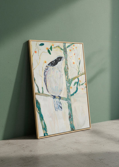 Bird no. 3 canvas print hanging above a sofa in a bright room with natural shadows and beige tones.
