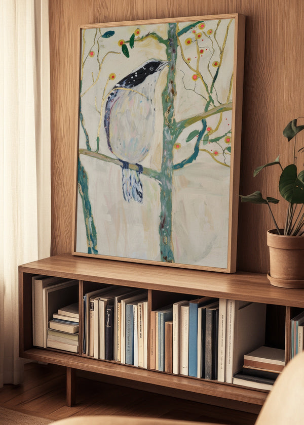 Framed Bird no. 3 poster displayed on a wooden bookshelf in a cozy Nordic living room setting