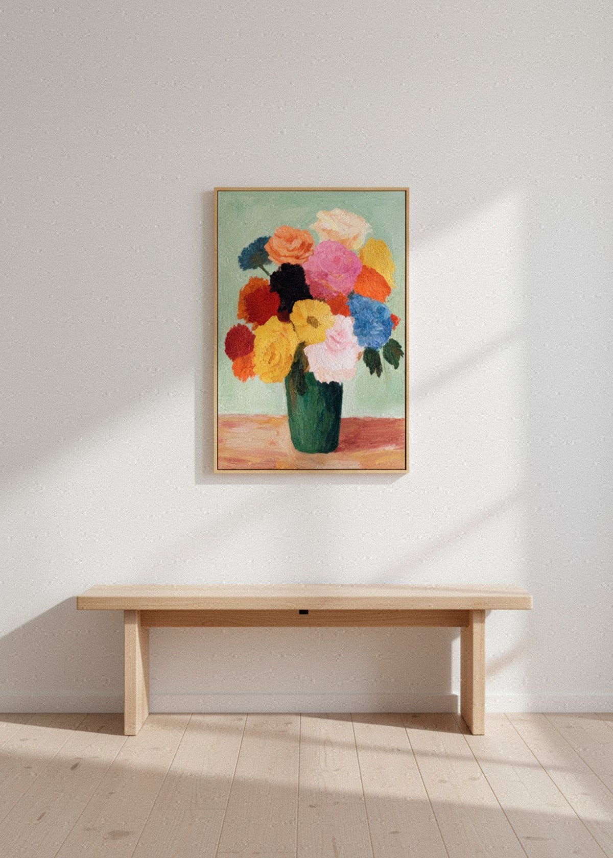 Blossoms canvas print displayed above a wooden bench in a neutral modern space. Colorful floral bouquet artwork in a green vase. Soft daylight and clean Scandinavian décor. HelloPoster canvas print.