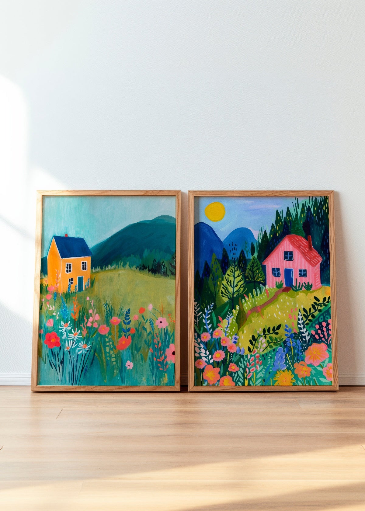 Framed art prints of Yellow House and Pink House, featuring vibrant countryside landscapes with blooming wildflowers, rolling hills, and charming houses. These colorful posters bring warmth and nature-inspired beauty to any home decor.