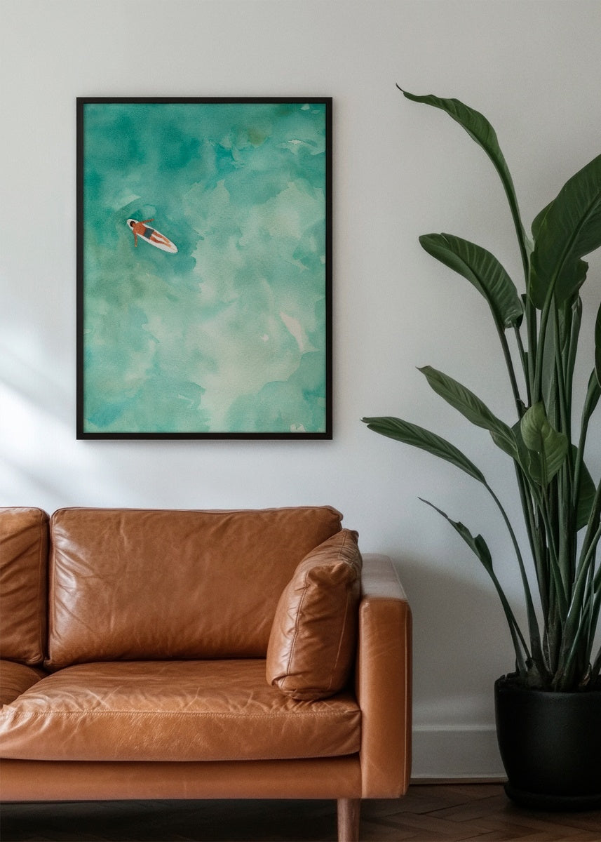 'Chill' poster in a masculine living room setting, featuring a serene green water scene paired with a brown leather sofa and a tall green plant. Perfect for adding a touch of calm sophistication to modern interiors."
