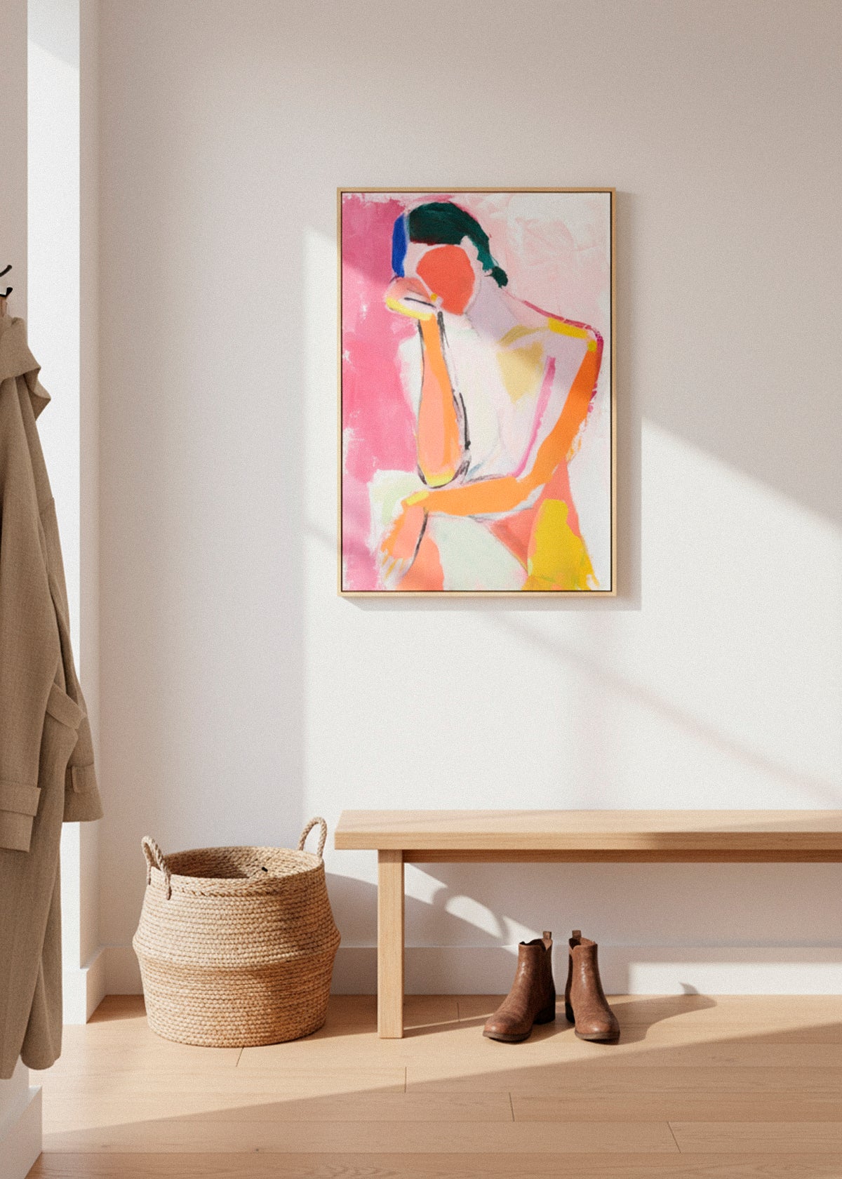 Feminine canvas hanging above a hallway bench on a white wall. Stylish soft-toned portrait perfect for a bright Scandinavian entryway.