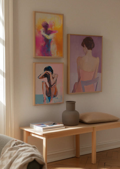 Hold Me, Ballroom & Croquis – Wall Art Display
Three art prints in soft light: a vivid abstract of two people embracing ("Hold Me"), a minimalist figure seated in introspection ("Croquis"), and a muted painting of a woman from behind ("Ballroom").