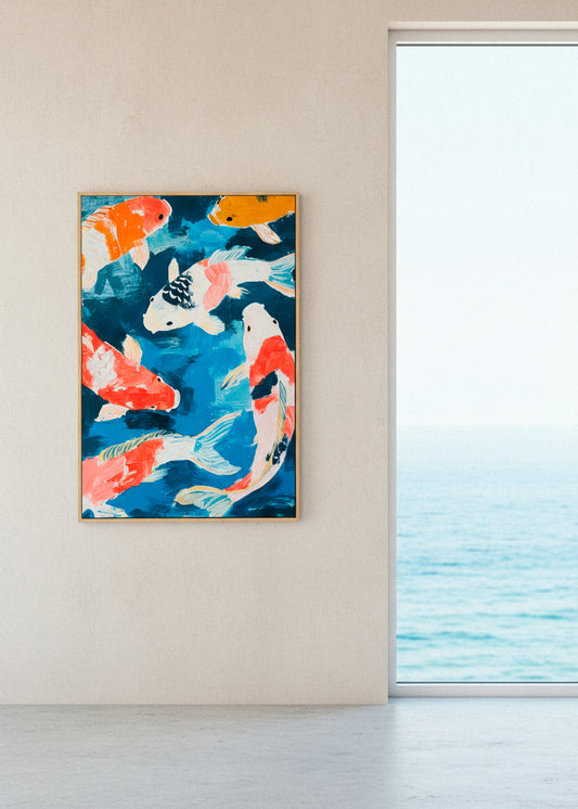Koi fish canvas hanging in a bright coastal home with ocean view through large window.
