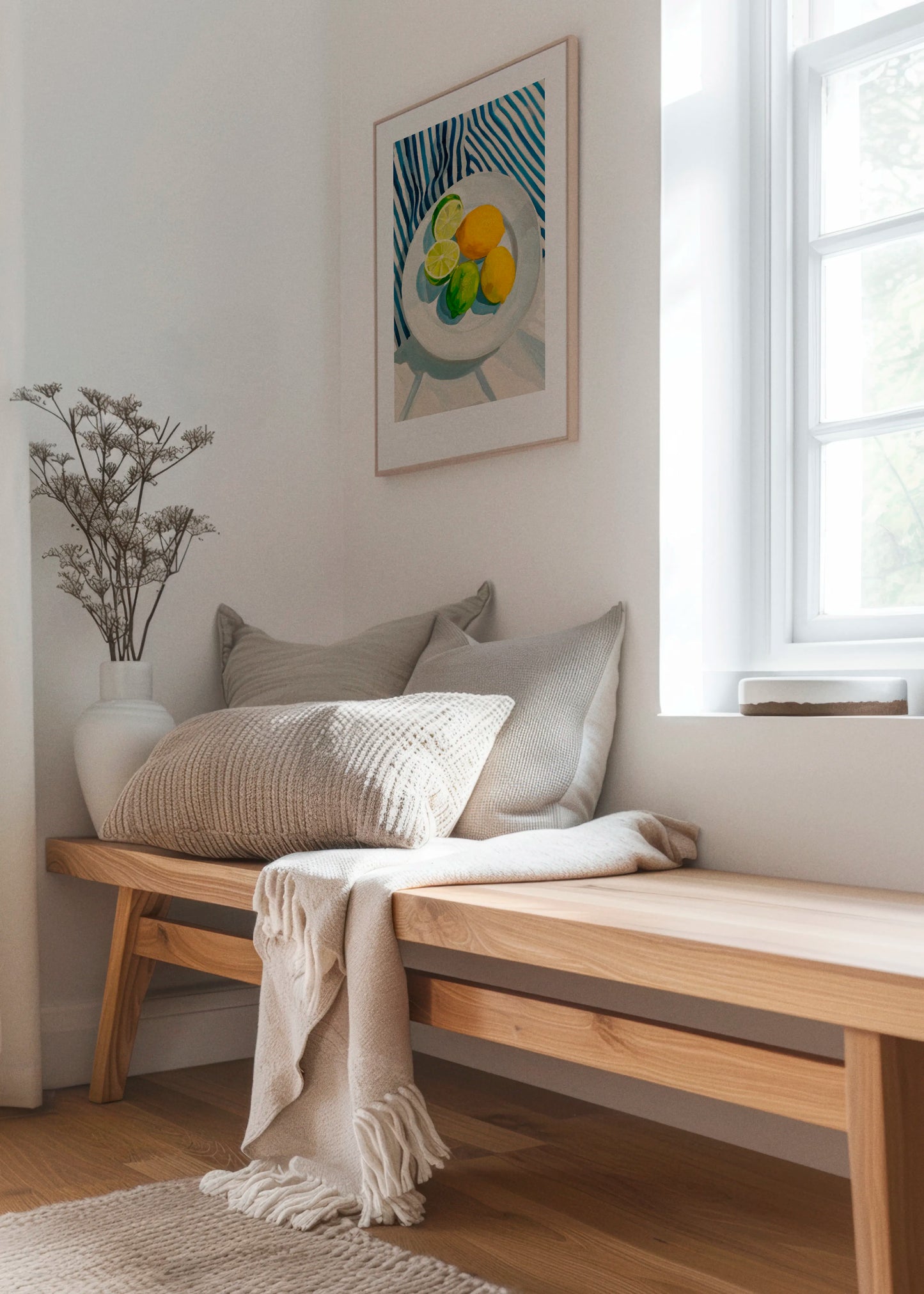 Lemon And Lime art print by Hello Poster styled in a bright Scandinavian interior above a wooden bench with soft textiles and natural light.