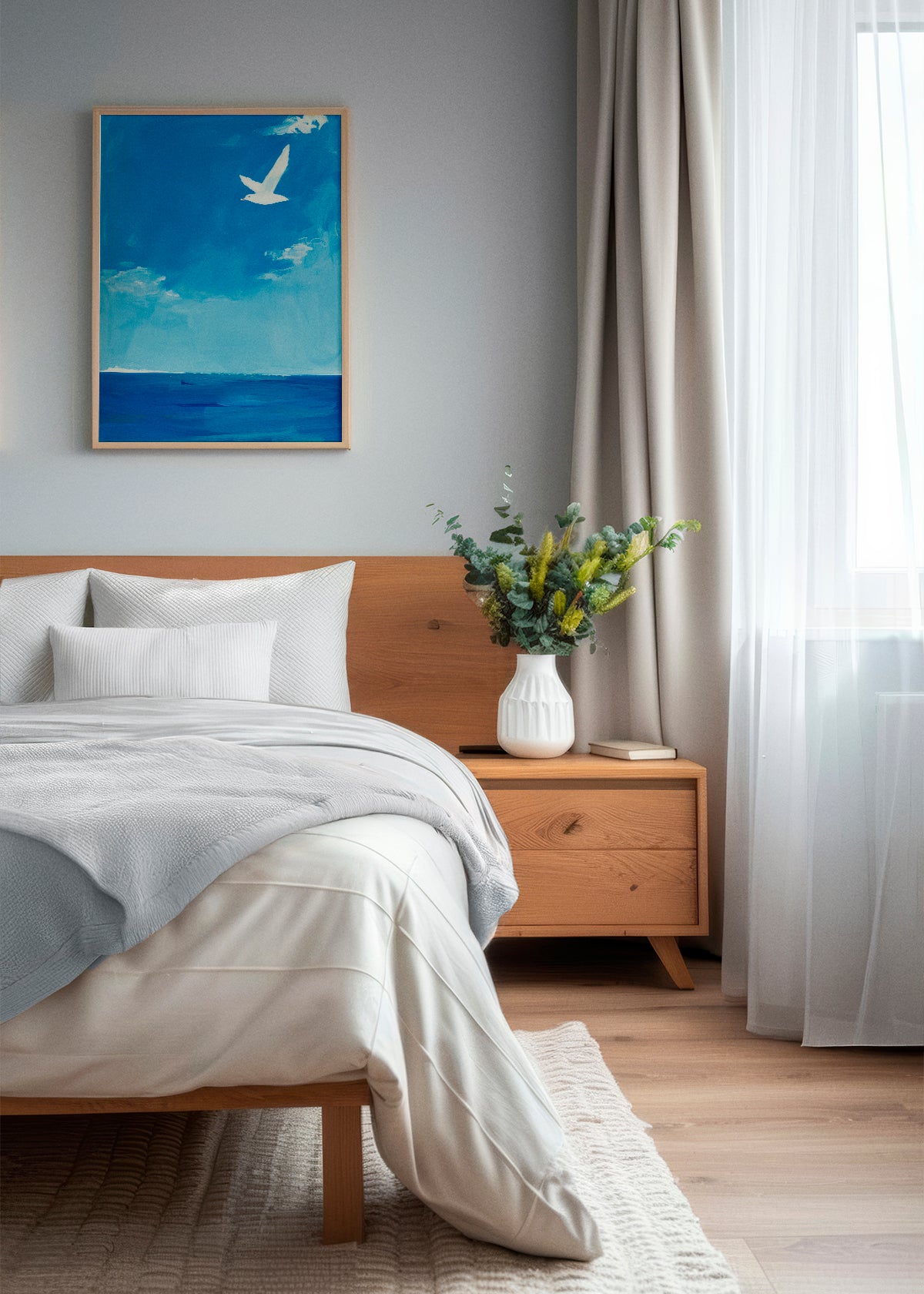 Calm and chill bedroom with a poster. Ocean poster framed and hung in a light bedroom with wood tones and white curtains