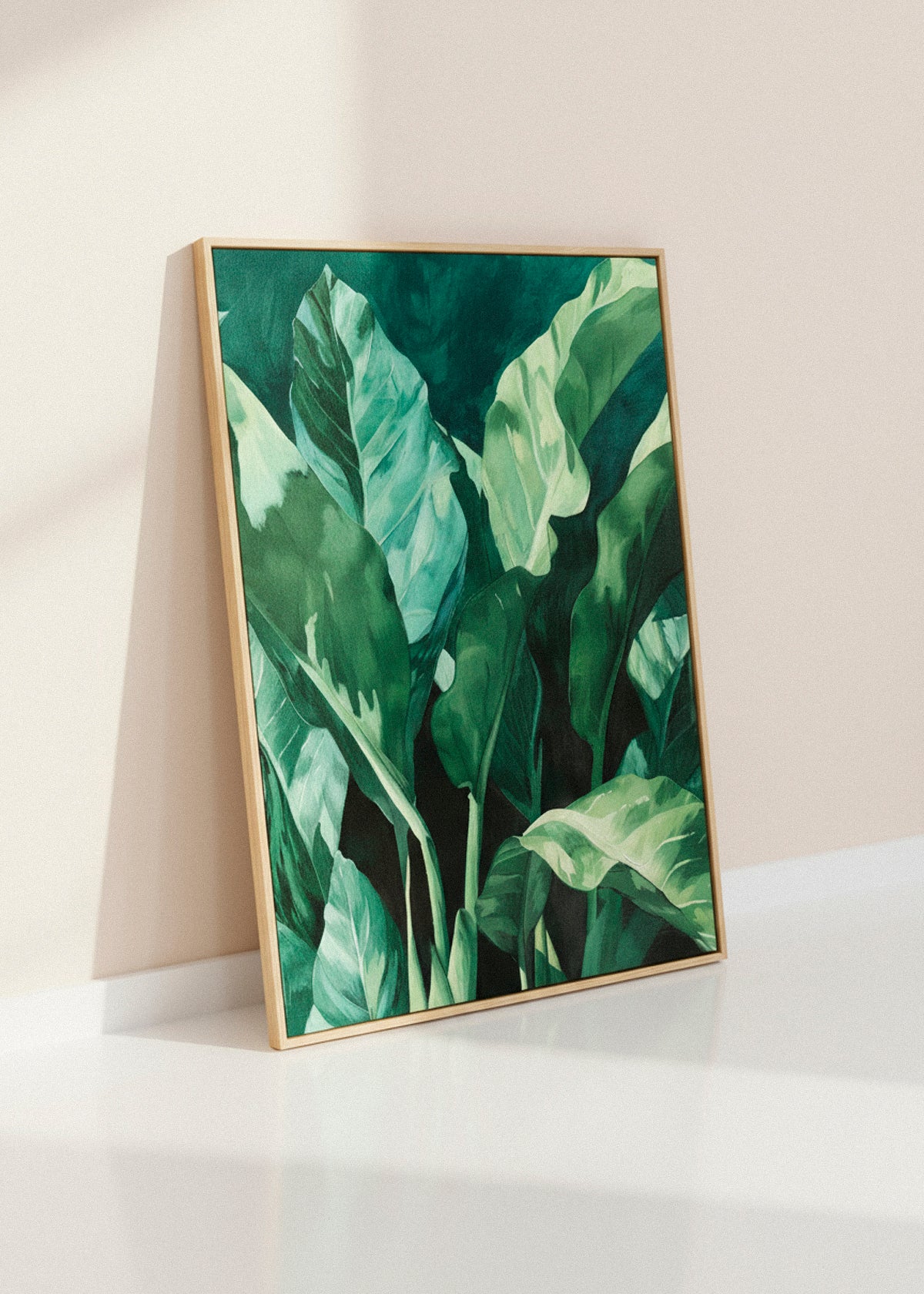 Framed “Plant” canvas print leaning casually against a light wall in soft daylight, highlighting its vibrant green tones.