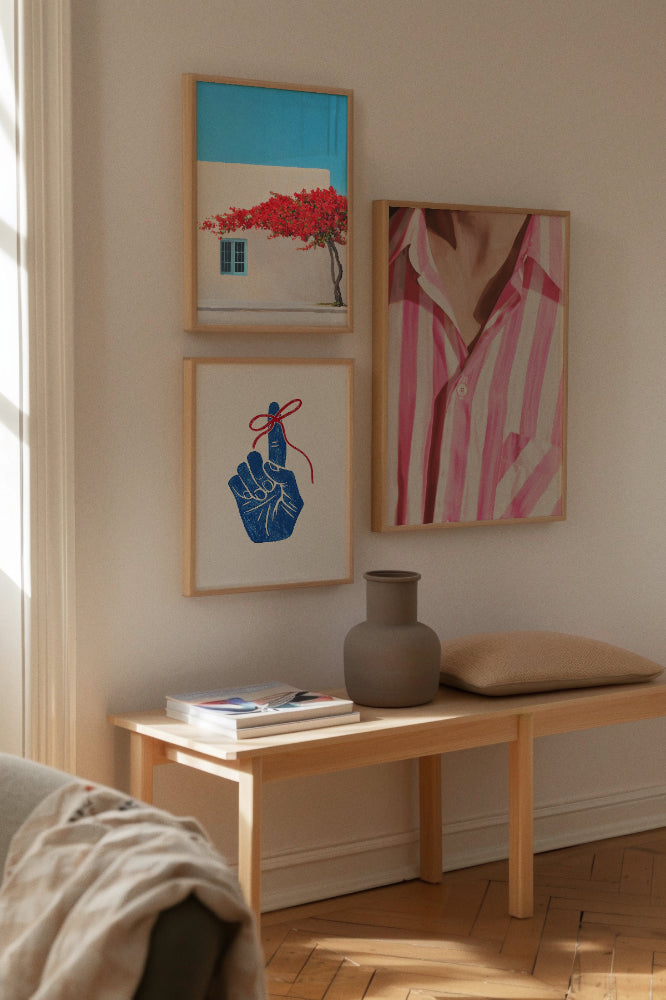 Siesta, Shirt & Remember – Colorful Poster Trio
Vibrant summer-themed wall display with a turquoise and red house with a blooming tree ("Siesta"), a blue hand with a red string tied to the finger ("Remember"), and a striped pink shirt close-up ("Shirt").