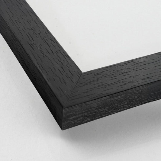 Close-up of black wooden frame corner with smooth painted finish – Nordic style.