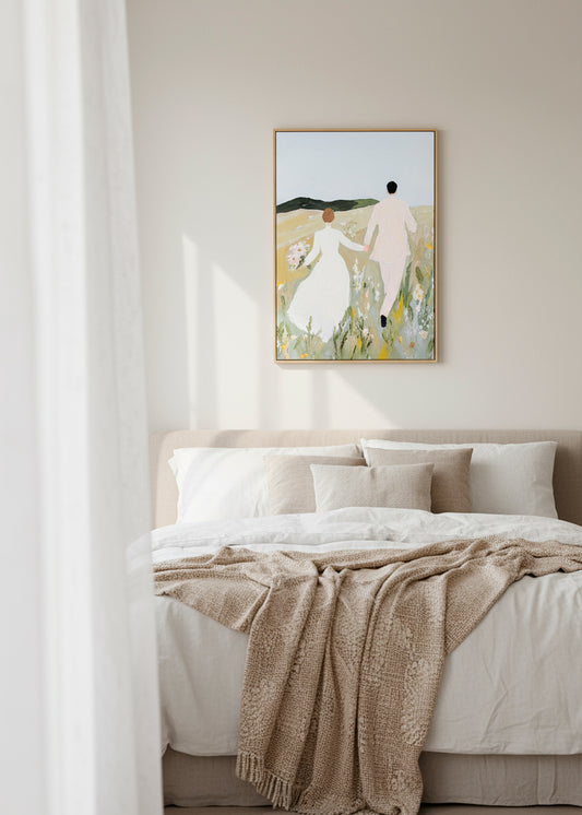 “Us” canvas art hanging above a neutral bed in a soft, sunlit bedroom.