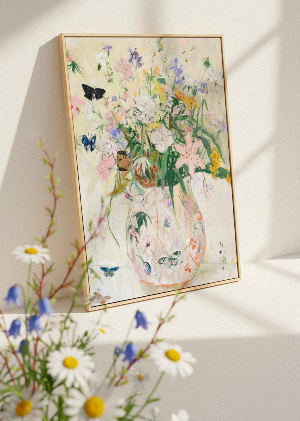 Wild Garden canvas hanging in a light and airy living room. Pastel flowers and butterflies create a soft botanical artwork ideal for nature-inspired interior décor.