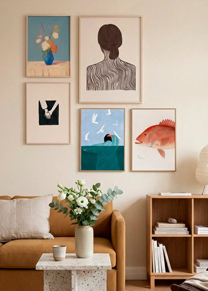 Centerpiece, Quietly Yours, Togetherness, Sea Side Serenity and Red Snapper posters styled as a curated gallery wall in a Scandinavian living room