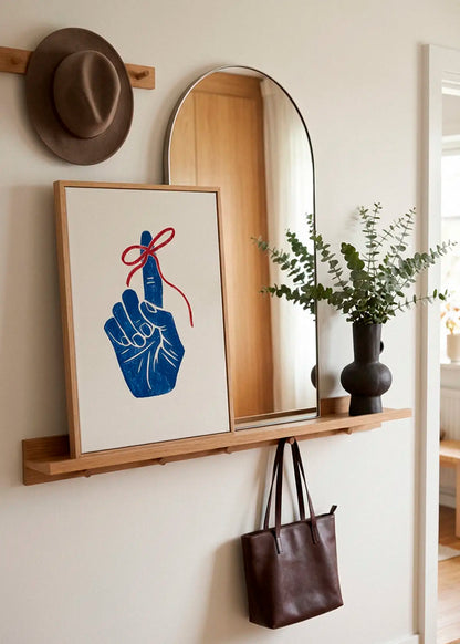 Remember poster styled in a Scandinavian entryway with mirror and wooden details