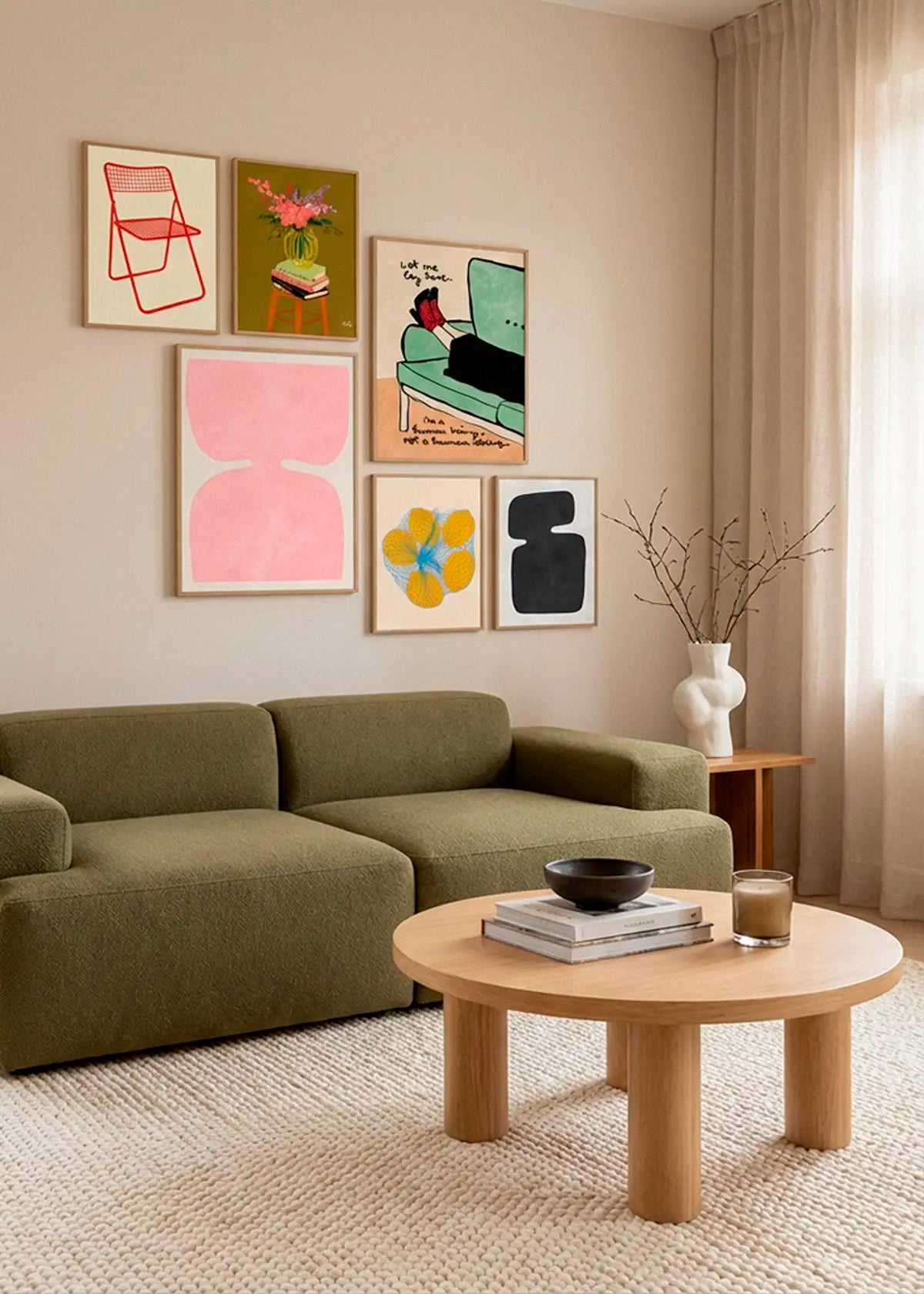 Ted Net Chair Red, Vase, Let Me Lay Here, Organic and Abstract 4, Five Lemons in a Net Bag and Organic and Abstract 2 posters styled above a sofa in a calm Scandinavian living room