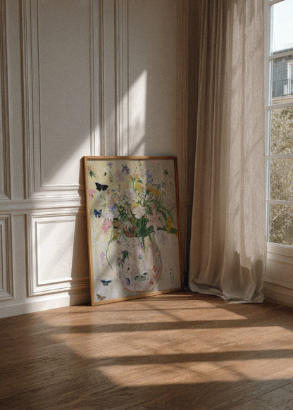 Wild Garden poster in an oak frame leaning against a classic paneled wall in a bright Scandinavian room, with soft natural sunlight and sheer curtains.